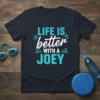 T-shirt with "LIFE IS better WITH A JOEY" text in aqua and white, with decorative water splashes