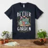 Life Is Better In The Garden text with gardening tools and flowers graphic on a dark t-shirt