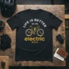 Life is Better on an Electric Bike quote with graphic bicycle and lightning bolt on black t-shirt