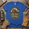 Life Is Better On The Farm text with barn and windmill graphic on blue t-shirt