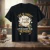 Black t-shirt with gold glitter text "LIFE IS SHORT BUY THE FABRIC" and a vintage sewing machine illustration surrounded by