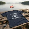 Navy blue t-shirt with white text "Life Is Simple Just Add Water" and a circular graphic of a river and