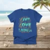 Blue t-shirt with gold and teal "To the Fullest LIVE LOVE Infinitely LAUGH Every Cause You Get" text and ocean-themed