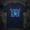 Living the SCRUB life MED TECH text with medical graphics on a navy blue t-shirt