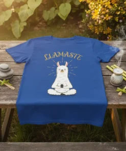 LLAMASTE text above a white llama meditating in a yoga pose on a blue t-shirt