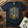 Look Like 22 Feel Like 18 Act Like 10 50 graphic t-shirt in gold art deco design on navy blue