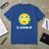 Blue t-shirt with a yellow emoji looking upwards, featuring glitch effects and the text "LOOKING UP" below