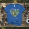 Blue t-shirt with "Love Grows Here Plant Parent" text and a heart shape filled with colorful succulents