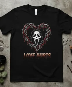 Black t-shirt with "LOVE HURTS" text and a Scream Ghost Face inside a thorny heart design