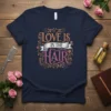 Love Is In The Hair quote t-shirt design with ornate floral elements and glittery text for hair stylists