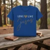 Blue t-shirt with "Love Like Jesus" text and a decorative heart graphic, primary keyword included
