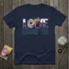Love Loaded Tea design with tie-dye 'O' and iced tea illustration on a navy t-shirt