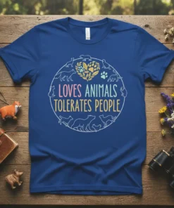 Loves Animals Tolerates People quote on a blue t-shirt surrounded by animal silhouettes and a paw print heart graphic