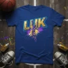 LUK basketball player mid-air slam dunk graphic on a royal blue t-shirt. The word LUK is in distressed gold lettering