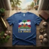 Haitian flag with L'UNION FAIT LA FORCE text on a blue t-shirt, featuring palm trees and crest