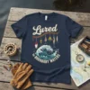 T-shirt design featuring "Lured to Boundary Waters" text with fishing lures hanging and a wave graphic