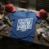 Blue t-shirt with "LYIN' KAMALA YOU'RE FIRED! 2024" in white distressed block letters and yellow stars