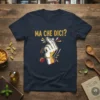 Navy t-shirt with "Ma Che Dici?" in gold text and a hand making the finger snap gesture with a tomato