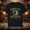 Black t-shirt with "Magical As Fuck" text and a glittery unicorn graphic, featuring gold lettering and colorful stars