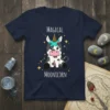 Magical Moonicorn text with a cute cartoon cow wearing a unicorn horn and ice cream cone hat, surrounded by stars