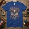 Make Christmas Great Again text with a patriotic eagle wearing a Santa hat on a blue t-shirt