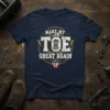 Make My Toe Great Again humorous t-shirt design with a graphic of a prosthetic toe and American shield