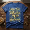 Blue t-shirt with "Make Way it's my Mom's 70th Birthday" in gold and teal glitter font, surrounded by fireworks and