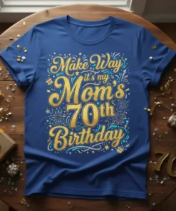 Blue t-shirt with "Make Way it's my Mom's 70th Birthday" in gold and teal glitter font, surrounded by fireworks and