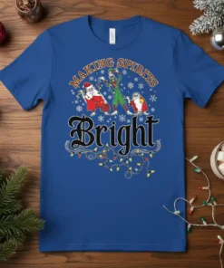 Making Spirits Bright Christmas T-Shirt with Santa and elf graphics, festive snowflakes, and colorful string lights