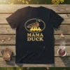 Mama Duck T-Shirt with a mallard and four ducklings inside an oval frame, golden text below