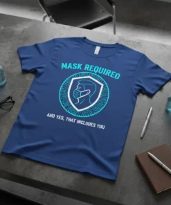 Blue t-shirt with "MASK REQUIRED AND YES, THAT INCLUDES YOU" text and a shield graphic of a person wearing a