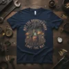 The phrase "May The Bridges I Burn Light The Way" on a dark navy t-shirt with a vintage industrial steam