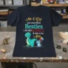 Me & Gigi are more than Besties t-shirt design with two dinosaurs and the quote "I AM HER ACCOMPLICE &