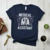 Medical NA Assistant t-shirt with Caduceus symbol and heart accents, white text on navy blue shirt