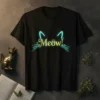 Black t-shirt with "Meow!" in golden glitter text, accented by blue cat ears and whiskers
