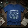 Meowcrobiology t-shirt with cartoon cats and microbes, white text and line art on blue shirt