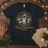 Merry Christmas text with a goat and surrounding farm animals graphic on a black t-shirt