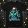 Merry Squatchmas Bigfoot wearing Santa hat and Christmas lights graphic t-shirt design