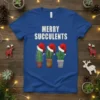 Merry Succulents Christmas t-shirt with three potted cacti wearing Santa hats