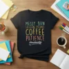 Black t-shirt with "Messy Bun Lesson Plans Coffee Patience #teacherslife" in colorful text, designed for teachers