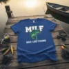 MILF MAN I LOVE FISHING t-shirt with a bass graphic and fishing quote, presented on a blue tee