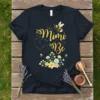 Mimi Be t-shirt design with golden cursive text, a bumblebee, and floral accents