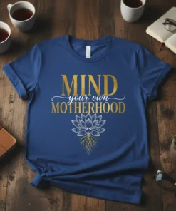 Mind Your Own Motherhood quote t-shirt with lotus flower graphic in gold and white on a navy blue tee