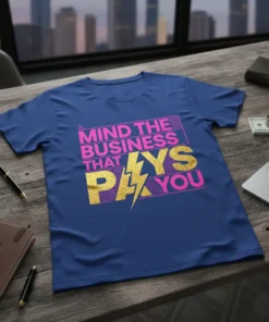 "Mind The Business That Pays You" quote in pink and gold glitter on a blue t-shirt, motivational business design