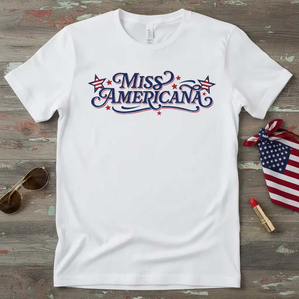 Miss Americana text design featuring patriotic stars and wavy blue and red lettering on a white tee