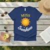 Miss Sunshine t-shirt with a smiling sun graphic and yellow text