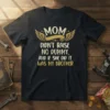 Mom Didn't Raise No Dummy, And If She Did It Was My Brother quote on a black t-shirt with gold