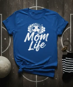 White "Mom Life" text with a soccer ball graphic on a blue t-shirt, representing soccer mom pride