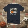 MOM Mom Life t-shirt with basketball and soccer graphics, bold white text, and laurel accents