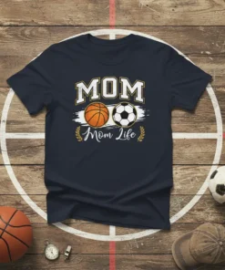 MOM Mom Life t-shirt with basketball and soccer graphics, bold white text, and laurel accents